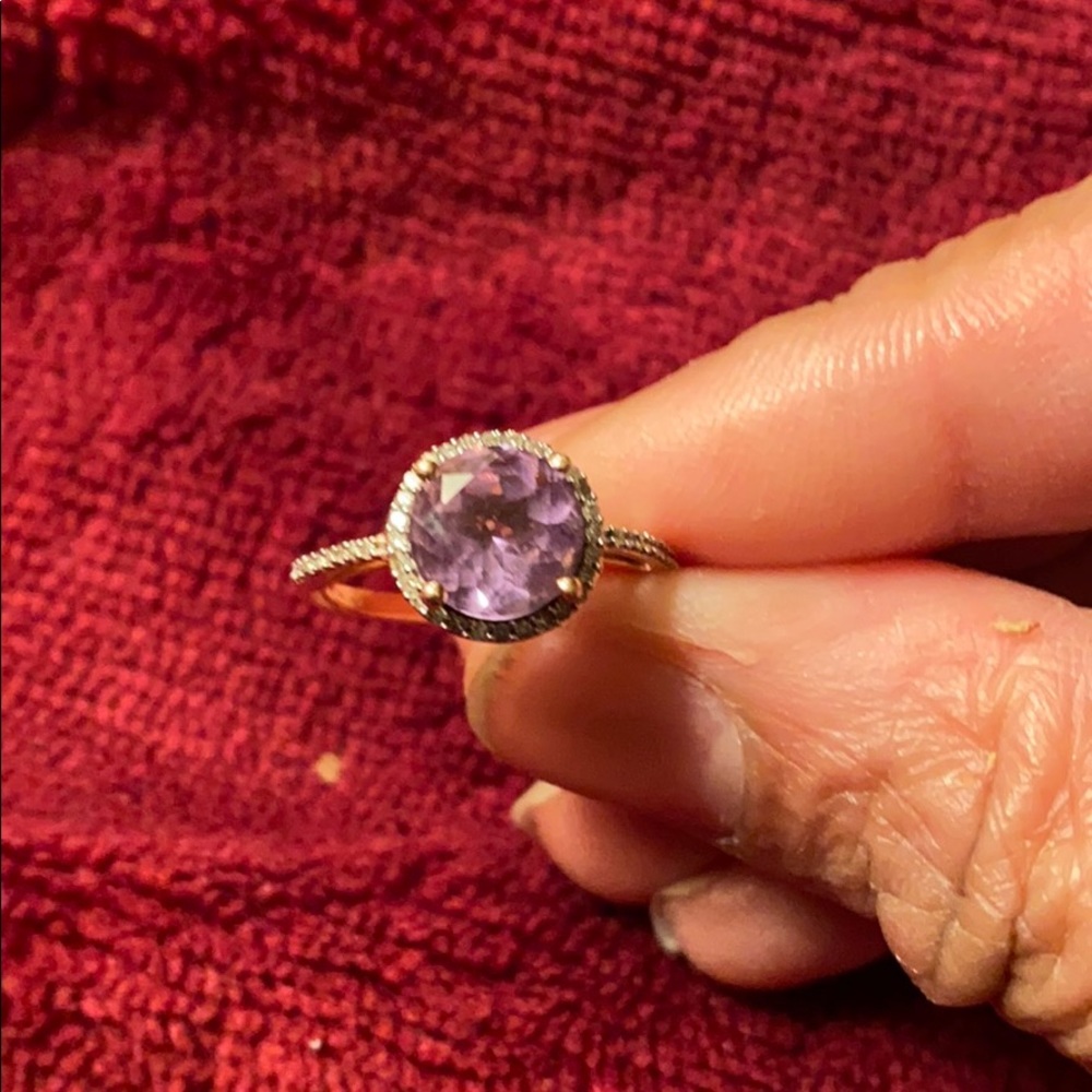 10kt rose gold ring. Size 6. With a Purple Stone